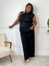 Découvrez l'ensemble noir grande taille Jazz, alliant confort et élégance. Le pantalon à taille élastique assure une tenue agréable toute la journée, tandis que le haut sans manches, orné d'un détail boucle dorée à l'épaule, apporte une touche raffinée.