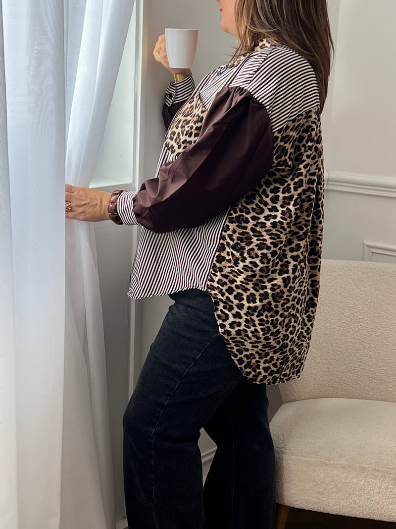 La chemise Madeline allie confort et style grâce à ses manches longues marron, sa coupe plus longue à l’arrière et ses détails léopard sur la poche, le dos et le col. Les poignets resserrés et les boutons sur toute la longueur assurent une tenue soignée au quotidien.