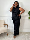 Découvrez l'ensemble noir grande taille Jazz, alliant confort et élégance. Le pantalon à taille élastique assure une tenue agréable toute la journée, tandis que le haut sans manches, orné d'un détail boucle dorée à l'épaule, apporte une touche raffinée.