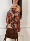 Apportez une touche de gaieté à votre garde-robe avec ce top en crochet Valentine. Conçu avec des manches longues et un col rond, il offre confort et élégance au quotidien. Sa couleur vive met en valeur votre silhouette tout en restant léger et agréable à porter.
