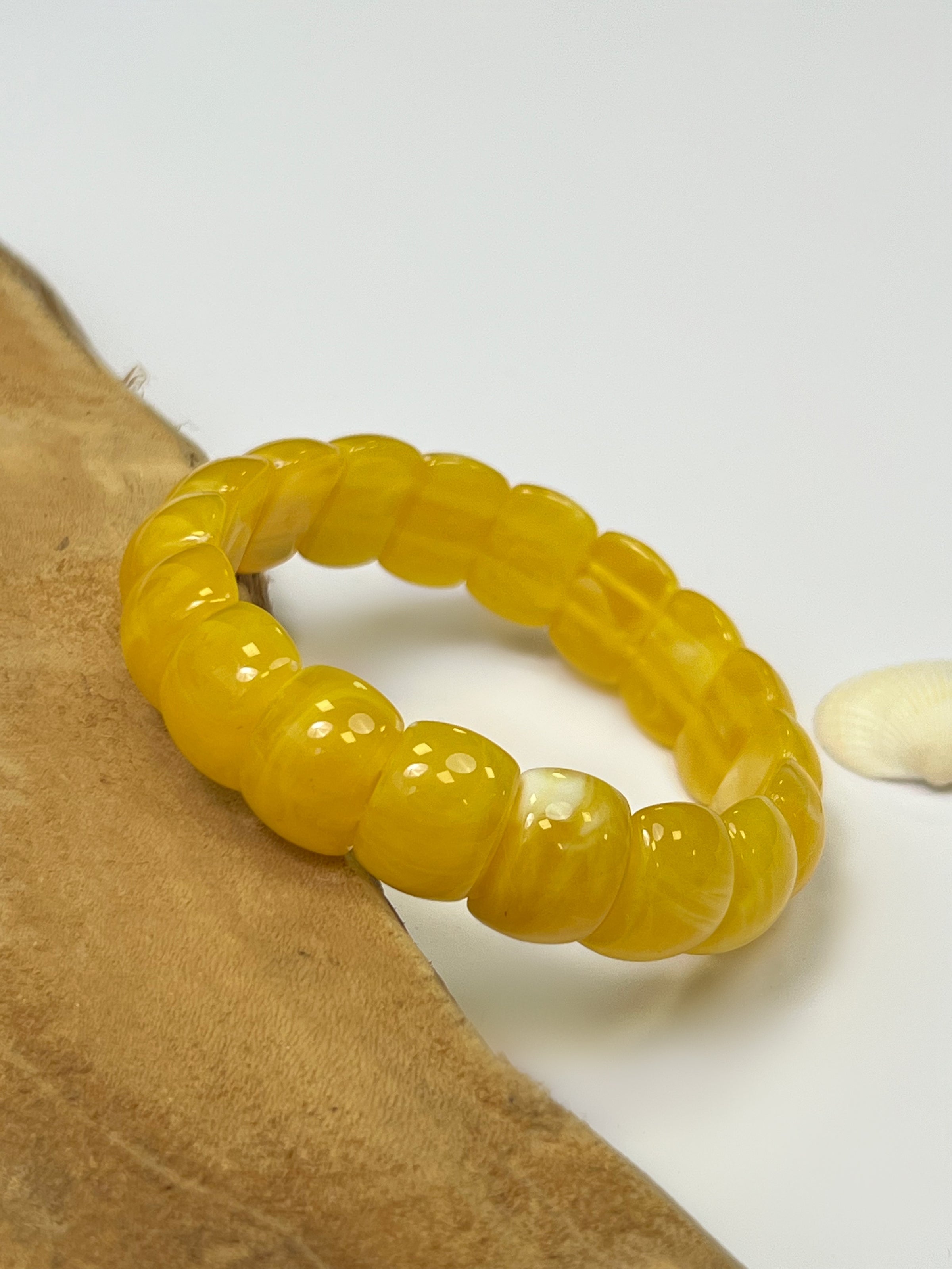Yellow bracelet: Maya