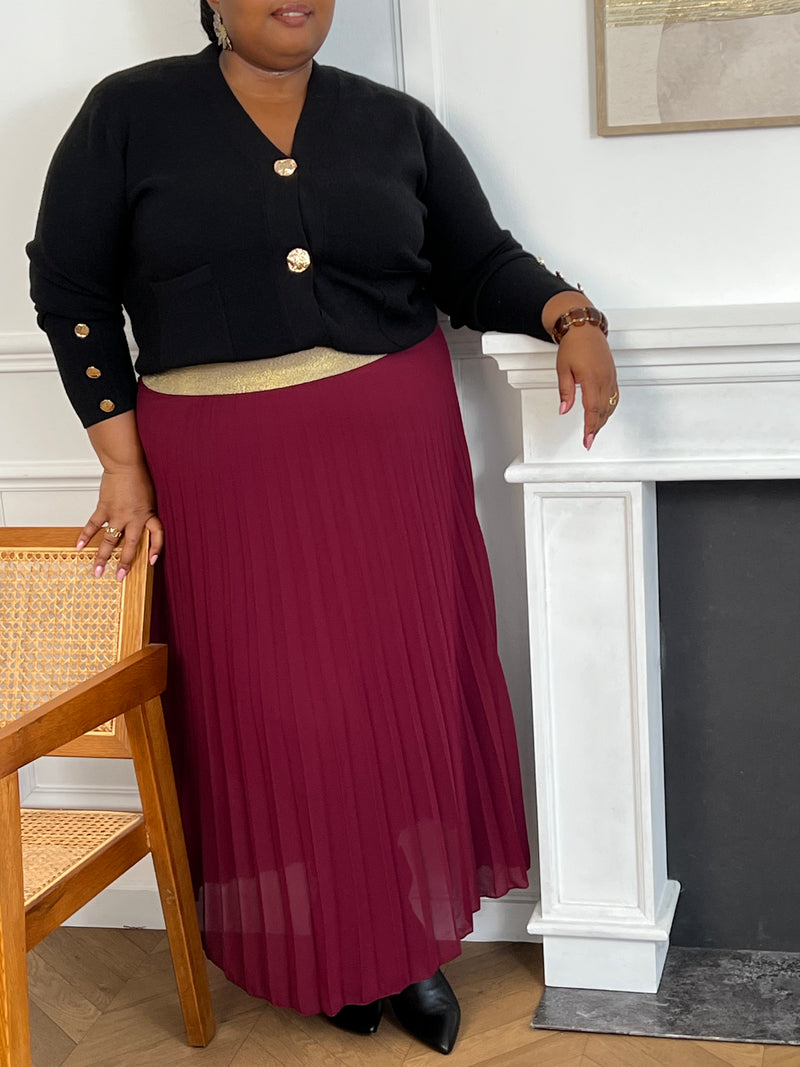 Découvrez notre jupe plissée, conçue en taille unique pour flatter les silhouettes du 42 au 50, disponible dans une gamme de couleur captivantes pour s'adapter à chaque style