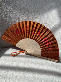 Éventail orange pailleté : Qué calor
