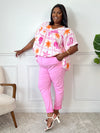 Blouse grande taille en gaze de coton ajourée, col V et manches courtes. Motifs coquillage et soleil en écru, orange et violet pour un look audacieux et frais.