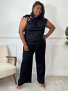 Découvrez l'ensemble noir grande taille Jazz, alliant confort et élégance. Le pantalon à taille élastique assure une tenue agréable toute la journée, tandis que le haut sans manches, orné d'un détail boucle dorée à l'épaule, apporte une touche raffinée.