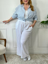 Ce pantalon écru grande taille Maloe est à la fois chic et décontracté. Fabriqué en gaze de coton, il est léger et confortable à porter toute la journée.