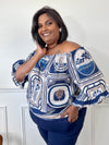 Mettez vos épaules en valeur avec notre blouse Nayla au col bateau élastique ! Avec son design original et motifs divers, cette blouse bleue à manches courtes vous rendra irrésistible.