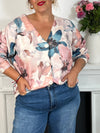 Ce gilet fleuri grande taille Patricia offre une coupe confortable avec ses manches longues et son col en V flatteur. Ses boutons sur toute la longueur facilitent l’enfilage, tandis que le motif floral coloré apporte une touche de gaieté à vos tenues.