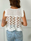 TOP EN CROCHET BLANC AVEC BRODERIE EN COTON Top en crochet Sans manches Broderie Couleur : écrue Ajouré et échancré sur le côté Composition : 100% Coton