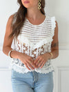 TOP EN CROCHET BLANC AVEC BRODERIE EN COTON Top en crochet Sans manches Broderie Couleur : écrue Ajouré et échancré sur le côté Composition : 100% Coton